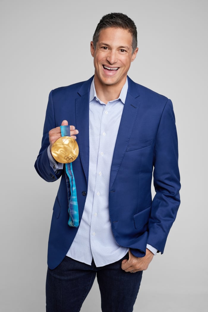 Steve Mesler poses with the gold medal he won at the 2010 Winter Olympics in Vancouver for four-man bobsled.